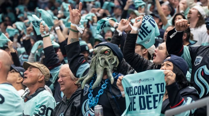 Fans celebrate a Seattle Kraken goal during game three of the second round of the 2023 Stanley Cup Playoffs.
